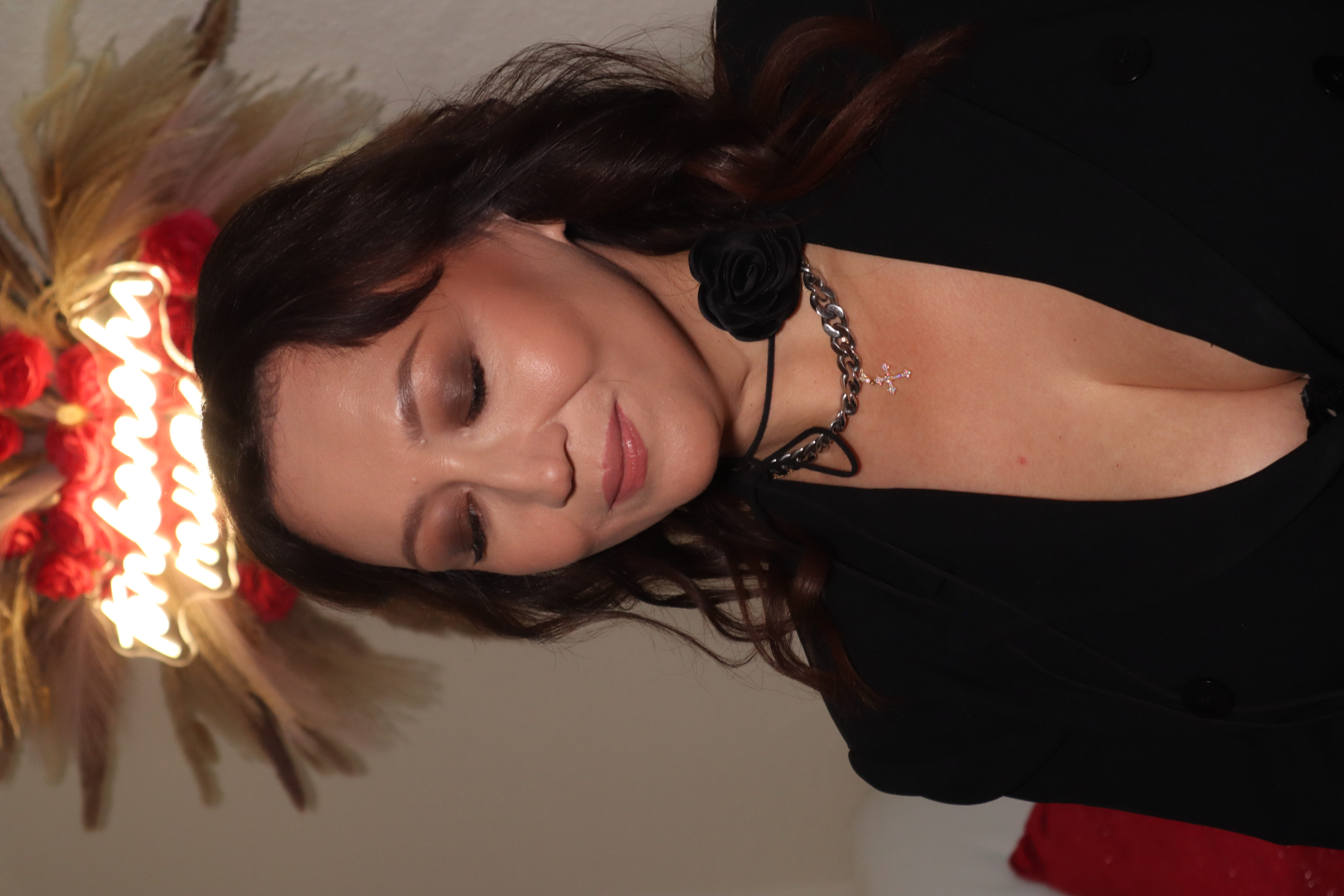 Portrait under TONKONOH.MUA neon sign